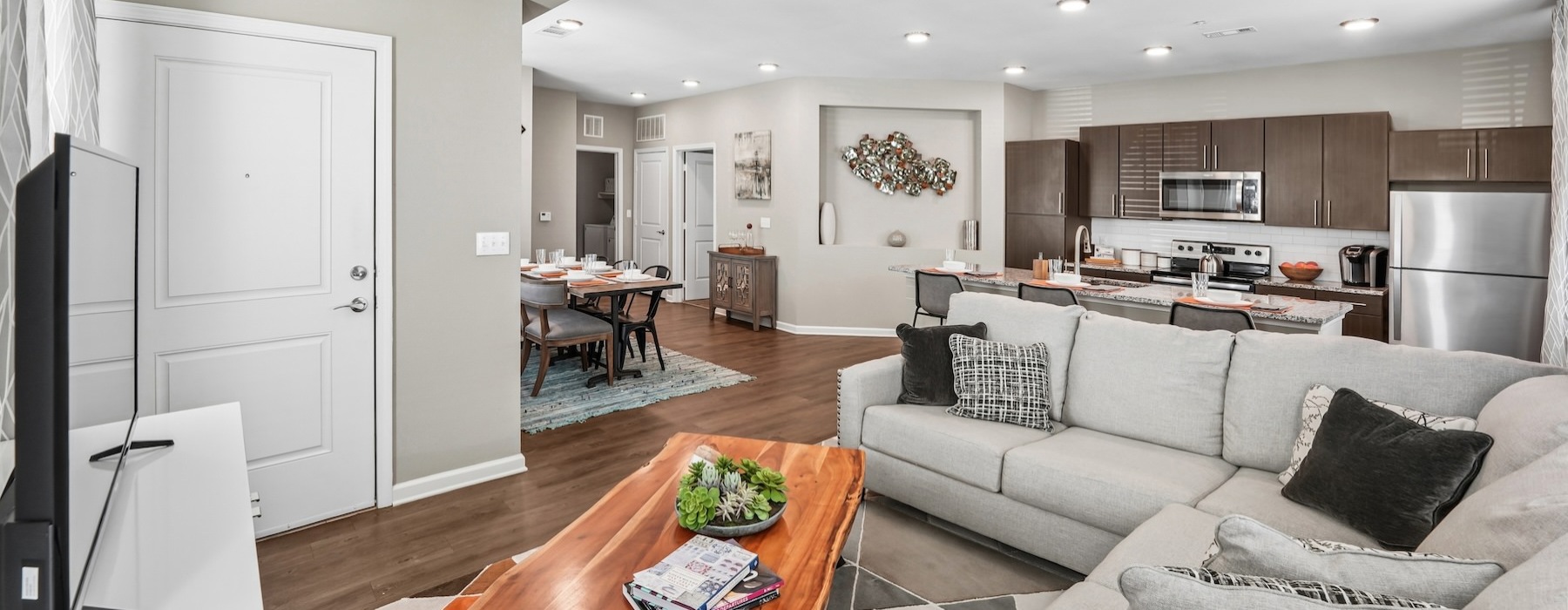 a living room with a couch and a table